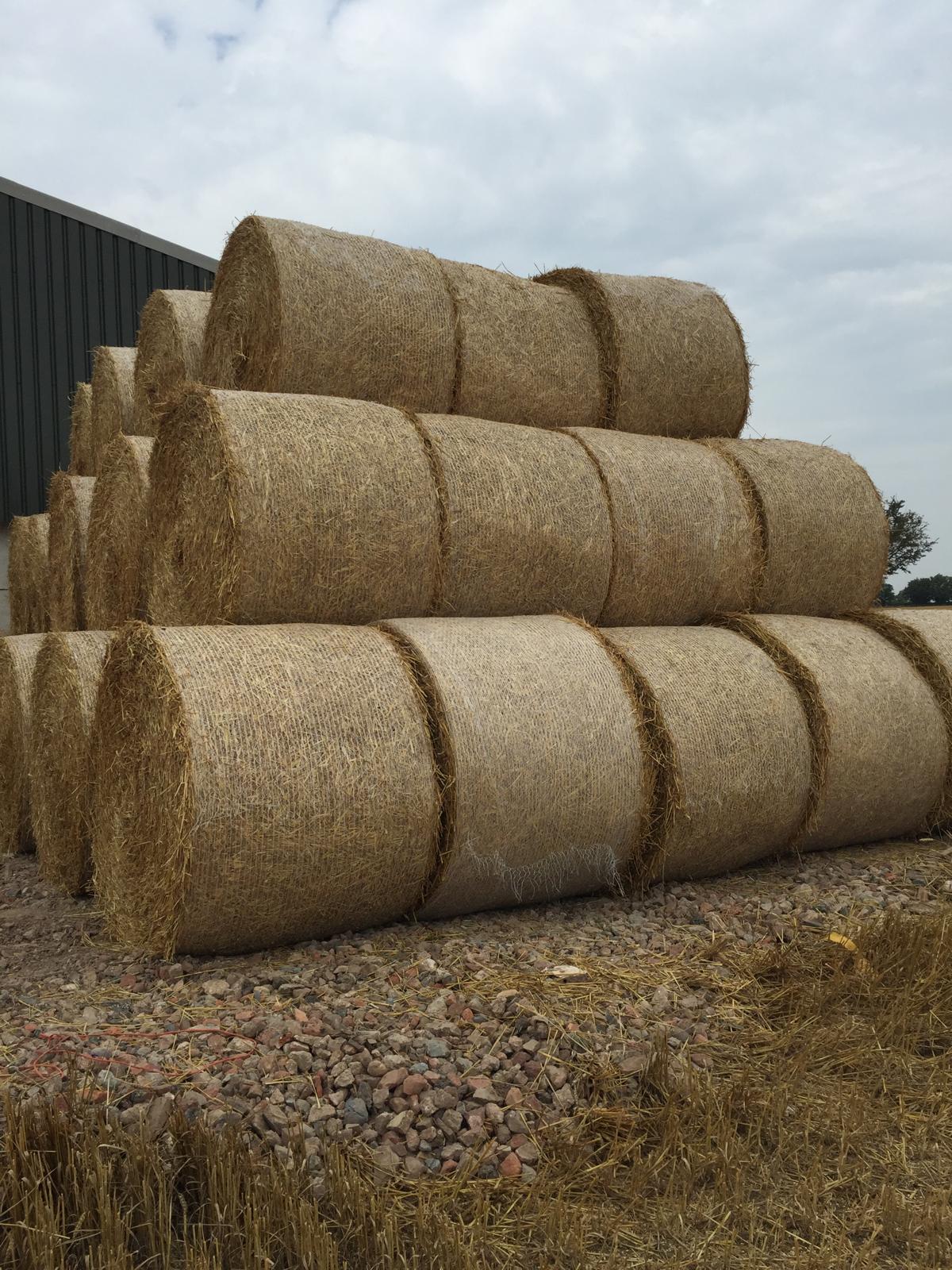 Stacked bales of hay wrapped in Farmer's E2E Netwrap